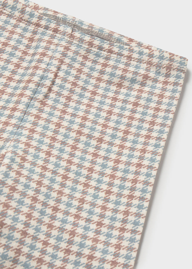 Dettaglio leggings neonata Mayoral con fantasia pied-de-poule nei toni dell'écru, rosa cipria, azzurro e beige