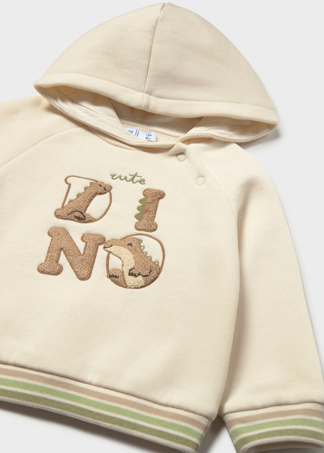 Dettaglio felpa neonato Mayoral beige con applicazione dinosauri