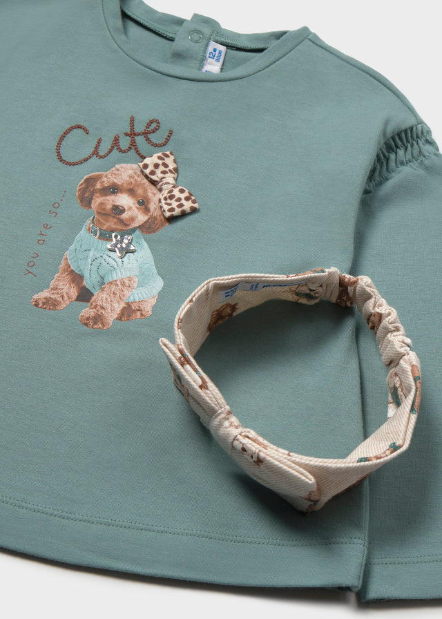 Dettaglio maglia neonata Mayoral verde acqua con stampa di cucciolo e fiocco animalier